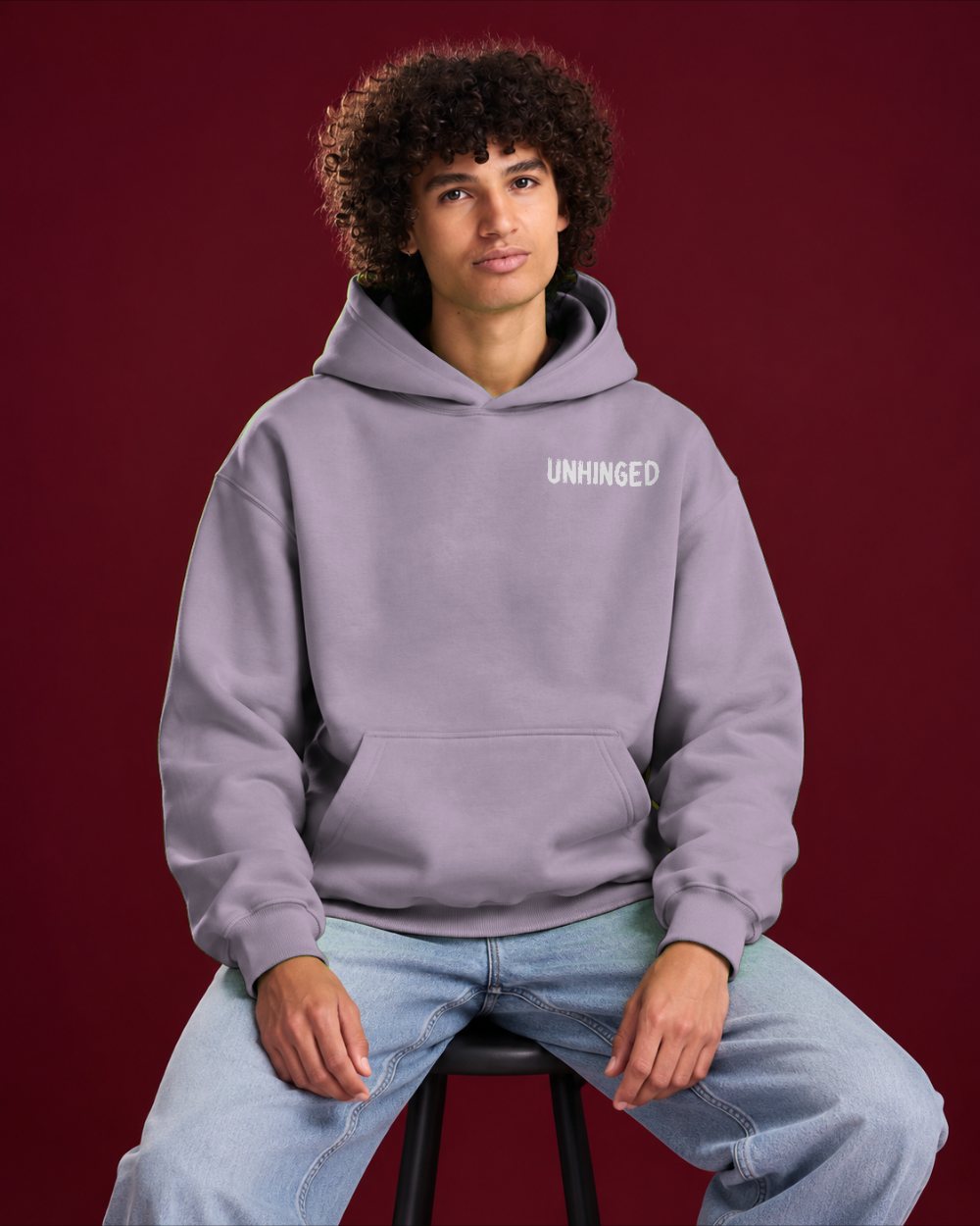 Mr Unhinged — Dusty Lilac heavyweight hoodie, seated view